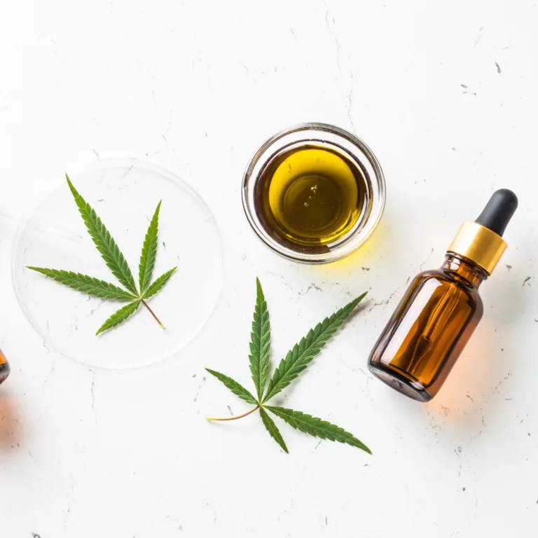 CBD oil and cannabis leaves